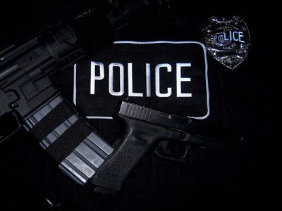 Police equipment and badges on a dark background