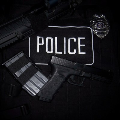 Police gear displayed with firearm and equipment