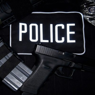 Police gear displayed with firearm and magazine