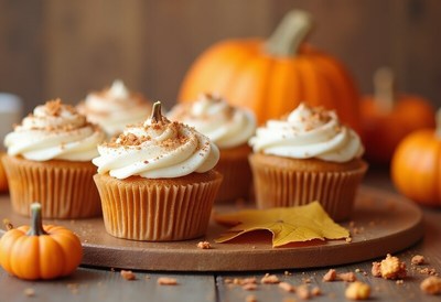 Delicious pumpkin cupcakes with autumn decorations