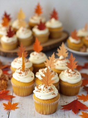Festive pumpkin cupcakes with autumn decorations