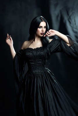 Dark elegance in a flowing black dress at night