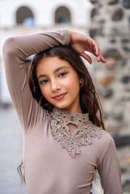 Beautiful girl posing with confidence in casual attire