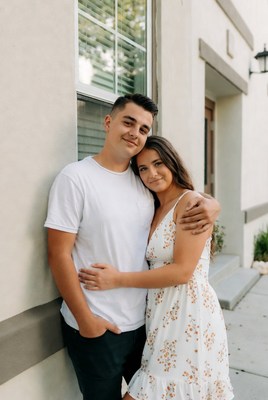 Couple sharing a sweet moment outside a building