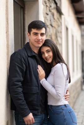 Couple embracing in charming street setting