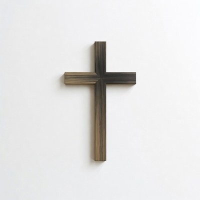 Wooden cross decor on a plain white wall