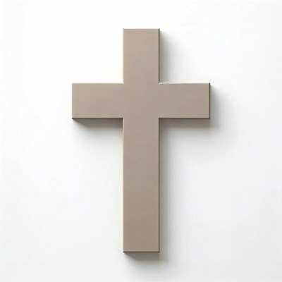 Modern cross design hung on a white wall in a minimal space