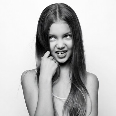 Girl with long hair making a playful expression