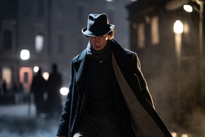 Mysterious figure walking through a foggy street at night