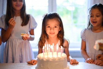 Sweet birthday celebration with friends in a cozy room