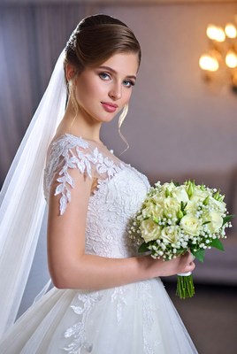 Bridal portrait in elegant indoor setting with bouquet