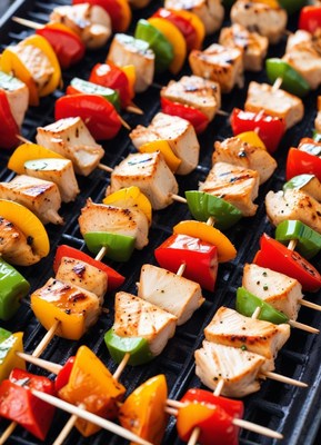 Grilled chicken and vegetable skewers on barbecue grill