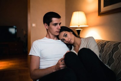 Young couple relaxing together in cozy room setting