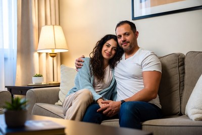 Couple enjoying a cozy moment indoors in soft lighting