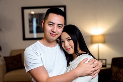 Couple embracing in cozy living room setting