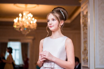 Girl with elegant hairstyle at formal event