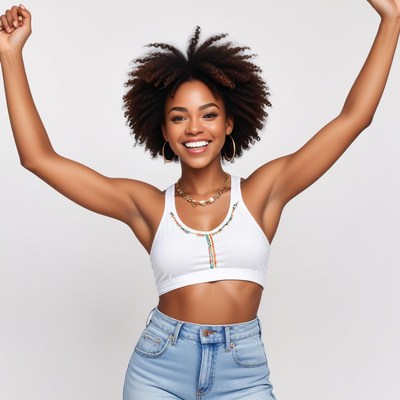 Young woman celebrating in casual outfit indoors