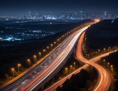 Nighttime cityscape with busy highway lights
