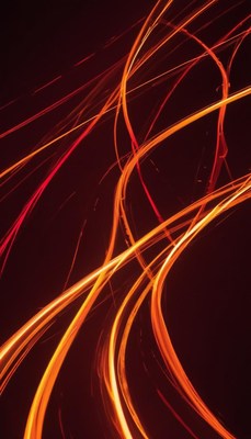 Bright orange and red light trails in dark setting