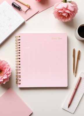Beautiful workspace with pink planner