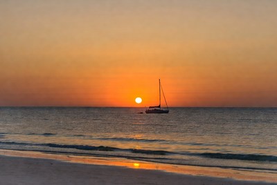 Sailing at sunset by the beach