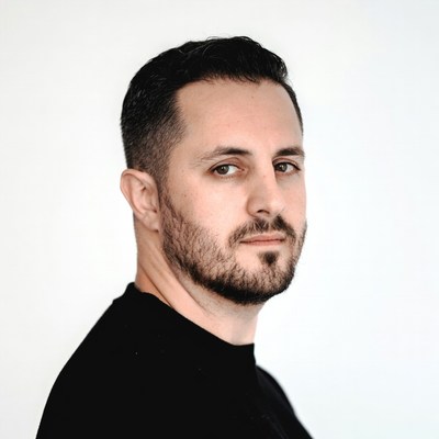 Man in black shirt with serious expression