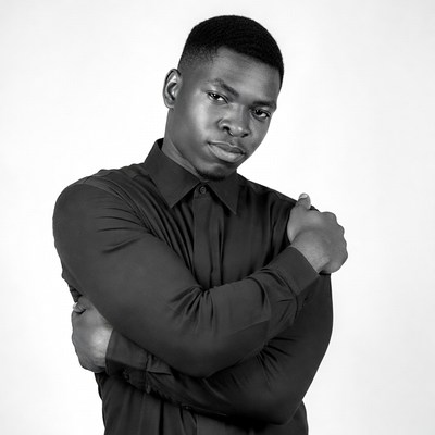 Confident man posing in black shirt