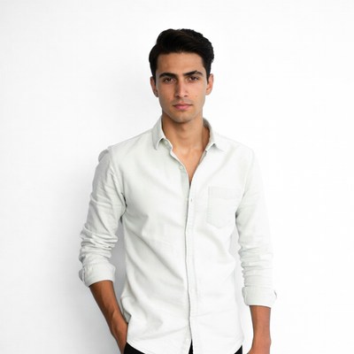 Young man in white shirt posing