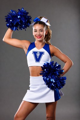 Cheerleader posing with pom-poms