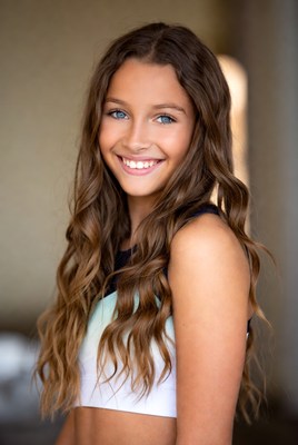 Young girl smiling in bright light