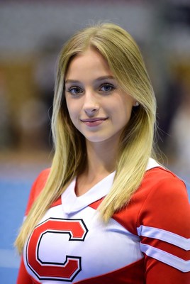 Cheerleader posing proudly at event