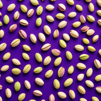 Colorful pistachios on vibrant backdrop
