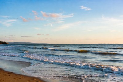 Waves breaking on sandy beach