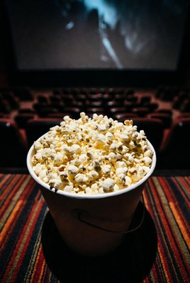 Enjoying popcorn in a cinema