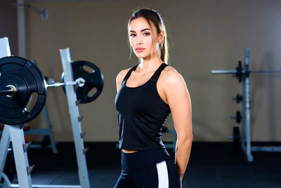 Strong woman in gym setting