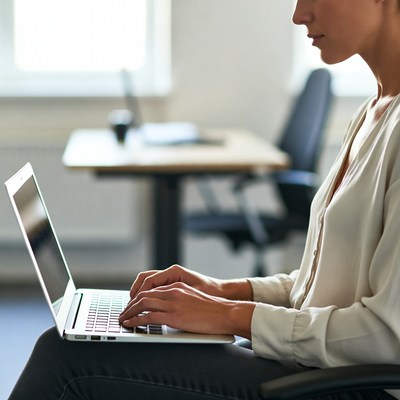 Working on a laptop in an office