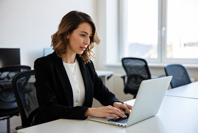 Woman working on laptop in office