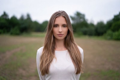 Young woman standing outdoors in a field