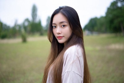 Young woman in a green field