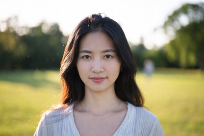 Woman in sunlit park