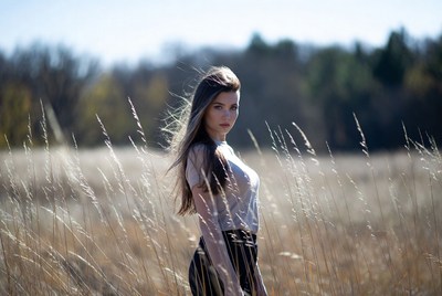 Model walking through a golden field