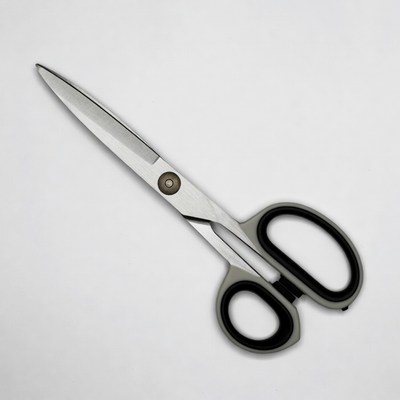 Sharp scissors on white surface