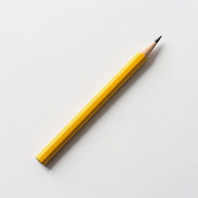 Yellow pencil on a white surface