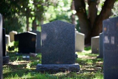 Gravestone in a peaceful cemetery scene