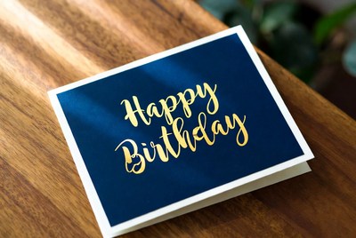 Birthday card on wooden table