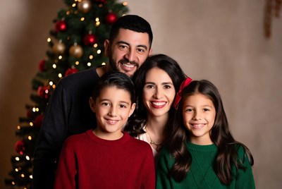 Family portrait by the christmas tree