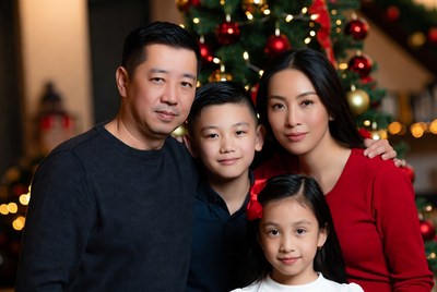 Family portrait near christmas tree