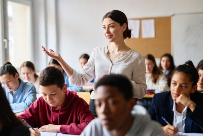 Teacher engaging with classroom students