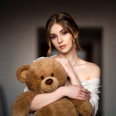 Young woman with a teddy bear