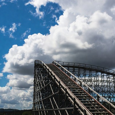 Wooden roller coaster under blue sky